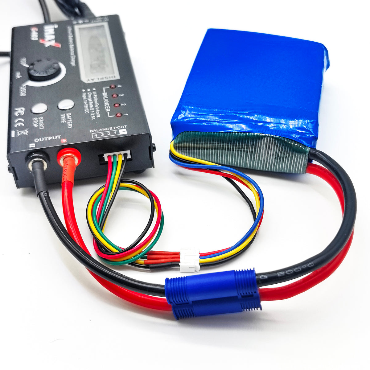 12V 5A 60W power adapter connected to an AC outlet for the balance charger